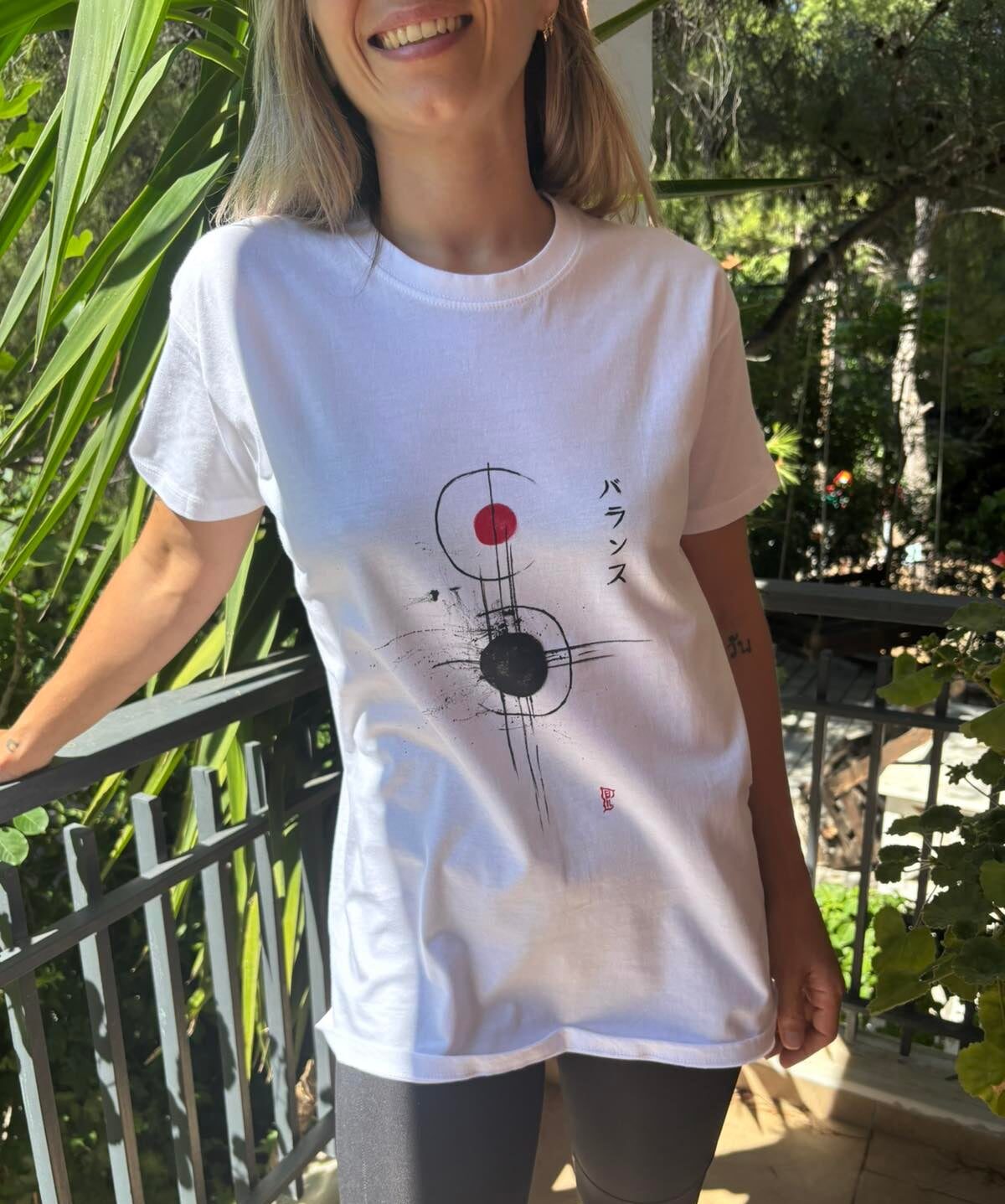 Hand-painted white t-shirt featuring abstract Japanese brush strokes, black and red circles and the word "Balance" in Japanese katakana.