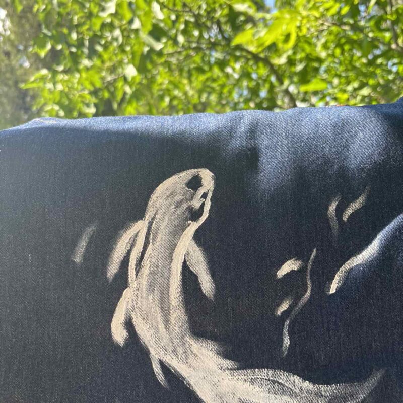 Hand-painted denim tote bag featuring a white koi fish in a minimalist Japanese-inspired style.